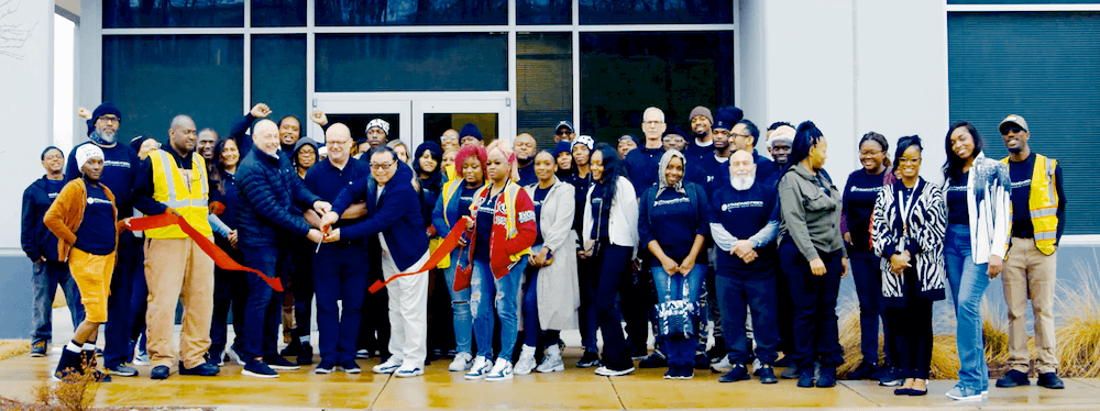 Altbaier (left, with scissors) cuts the ribbon to officially open Standard Fiber’s 180,000-square-foot facility in Atlanta in 2024. Rob Tillman, chief operating officer, and Wang are to his right.
