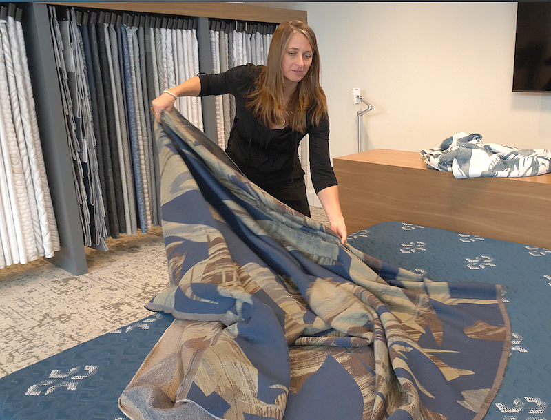 Tusa, a senior stylist, displays one of her designs at the Culp Innovation Center in downtown High Point, North Carolina. 