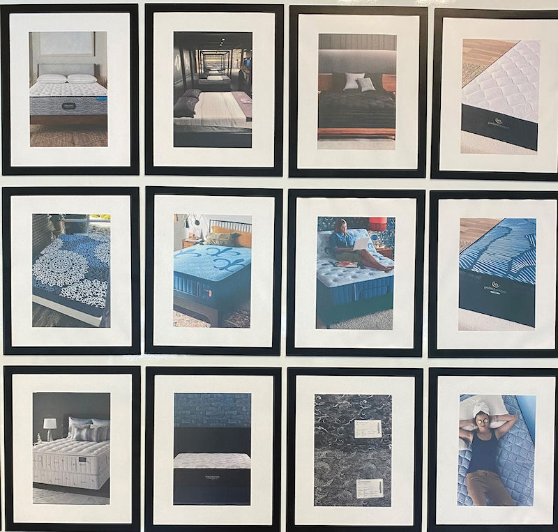 BekaertDeslee showroom innovation textiles. A wall of design projects welcomes visitors to the design workspace.