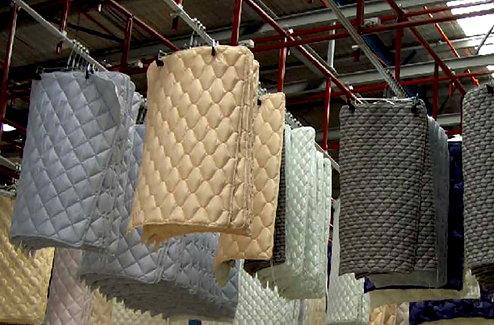 Discover the Leading Innovations in Bedding Sewing Technology. Gribetz partners with Eton Systems to automatically move mattress panels between stations or in a buffer waiting for automated instructions.