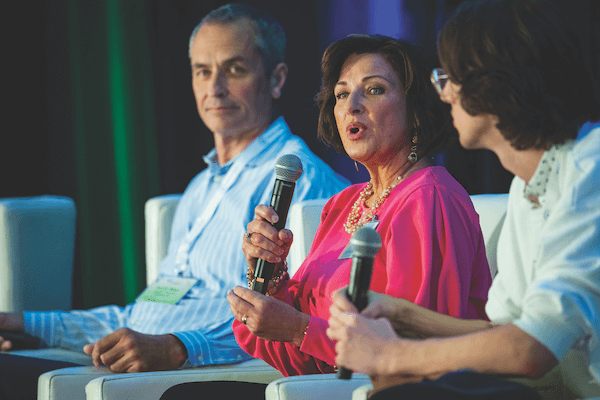 Sustainability in Sleep Industry. Jenny Tinsley of Culp Inc. discusses how the fabric supplier is attaining its sustainability goals as part of a panel titled “Parts of a Whole: How Manufacturers of Mattress Components Are Innovating for a More Sustainable Future.” The panel included Dennis Mater of Kaneka North America LLC, left, and Ethan McGuigan of Harrison Spinks, right.